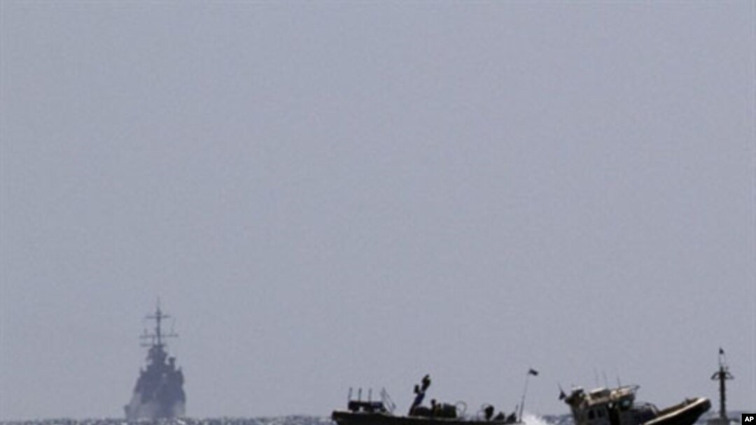 Israeli naval vessels (L) arrive at the port of Ashdod in southern Israel, 05 Jun 2010
