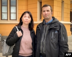 FILE - Natalia and Dmitry Protasevich pose for a photo after an interview with AFP in Wroclaw, Poland on May 25, 2021.