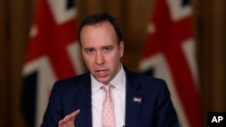 Britain's Health Secretary Matt Hancock speaks at a press conference inside 10 Downing Street on further restrictions to be put in place due to the ongoing coronavirus pandemic in London, Dec. 23, 2020.