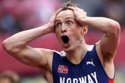 Karsten Warholm of Norway celebrates after winning gold, Aug. 3, 2021.
