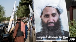 FILE - A poster of Taliban Supreme Leader Hibatullah Akhundzada is seen along a road in Kabul on Aug. 14, 2023.