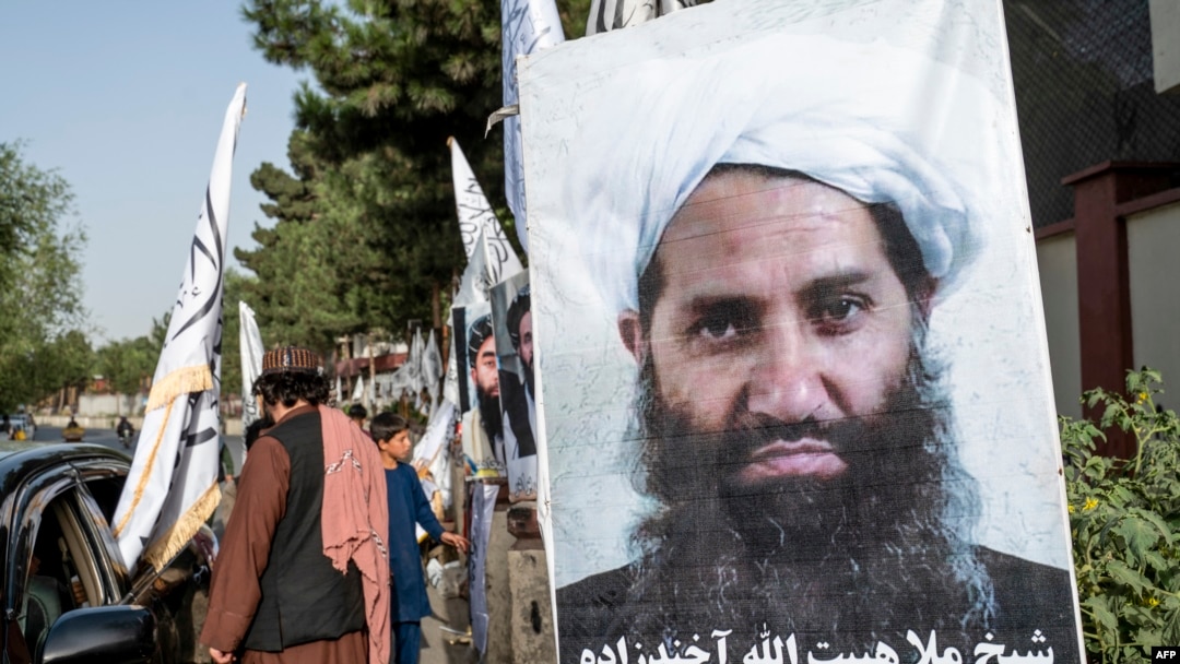 FILE - A poster of Taliban supreme leader Hibatullah Akhundzada is seen along a road in Kabul, Afghanistan, on Aug. 14, 2023. 