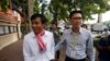 Journalists Uon Chhin, left, and Yeang Sothearin arrive at the municipal court, in Phnom Penh, Oct. 3, 2019. A Cambodian court has ordered a new investigation and postponed a verdict in the espionage trial of the two journalists.
