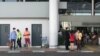 FILE: People stand at the arrival area at Phnom Penh International Airport, in Phnom Penh, on Jan. 24, 2020. (Khan Sokummono/VOA Khmer) 