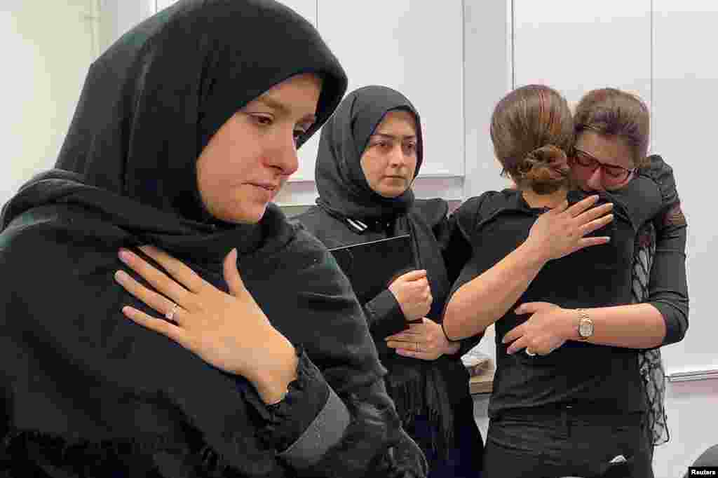 Mourners attend a vigil at University of Toronto student housing for the victims of a Ukrainian passenger jet, which crashed in Iran, in this still image taken from a video, in Toronto, Ontario, Canada, Jan. 8, 2020.