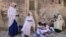 Ethiopian Orthodox Christian worshippers gather during Palm Sunday celebrations outside the Church of the Holy Sepulchre in Jerusalem on April 25, 2021. 