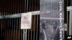 A photo taken Jan. 9, 2017, shows the locked gate and a historic marker at the now-abandoned A.G. Gaston Motel in Birmingham, Alabama. Once used by the Rev. Martin Luther King Jr., the motel will be renovated as the city's civil rights district joins the National Park Service. 