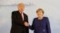 FILE - U.S. President Donald Trump and German Chancellor Angela Merkel pose for a photograph before a bilateral meeting on the eve of the G-20 summit in Hamburg, Germany, July 6, 2017. 
