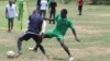 Players battle for possession of the ball at the inaugural Corporate League soccer series in Juba, which aims to bring South Sudanese together to forge friendships and promote peace. 