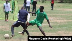 Players battle for possession of the ball at the inaugural Corporate League soccer series in Juba, which aims to bring South Sudanese together to forge friendships and promote peace. 