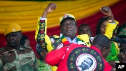 Zimbabwean President Emmerson Mnangagwa addresses the final rally of his campaign at the stadium in Harare, Zimbabwe, Saturday July 28, 2018. 