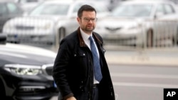 Marco Buschmann, parliamentary undersecretary of the German Liberals (FDP) arrives for coalition negotiations with representatives of the German Green party (Die Gruenen) and the German Social Democratic party (SPD) in Berlin, Germany, Oct. 21, 2021.