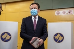 Albin Kurti, a candidate for prime minister of Vetevendosje (Self-Determination), prepares to cast his ballot in parliamentary elections in capital Pristina, Kosovo, Feb. 14, 2021.