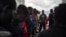 FILE - Migrants pray for Europe to grant them a place of safety as they travel aboard the Ocean Viking humanitarian ship in the Mediterranean Sea, Sept. 21, 2019. 