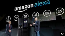 LG Electronics’ vice president David VanderWaal and Amazon Echo vice president Mike George present the LG Smart InstaView Door-in-Door Refrigerator to CES 2017 attendees at the LG Electronics press conference, Jan. 4, 2017, in Las Vegas.