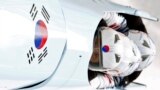 South Korea&#39;s pilot Kim Dong-hyun (front) and his teammates speed down the track during a four-man bobsleigh training session at the Sanki Sliding Center in Rosa Khutor, near Sochi, Feb. 20, 2014.&nbsp;