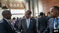 Djibouti Foreign Minister Ali Youssouf, center, talks to other delegates ahead at the African Union Summit on Feb. 15, 2025, in Addis Ababa, Ethiopia. Youssouf was elected chair of the AU Commission.