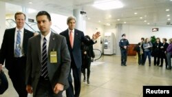 U.S. Secretary of State John Kerry (3rd L) arrives to brief members of the U.S. Senate on talks with Iran during a closed-door meeting at the Capitol in Washington, Dec. 11, 2013. 