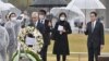 Japanese Prime Minister Fumio Kishida and U.S. Ambassador to Japan Rahm Emanuel visit Hiroshima's Peace Memorial Park on March 26, 2022. (Kyodo News via Reuters)