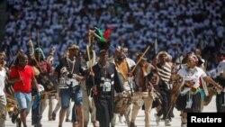 FILE—Supporters of the Inkatha Freedom Party (IFP) march across a pitch at the Election Manifesto launch in Durban, South Africa, March 10, 2024.