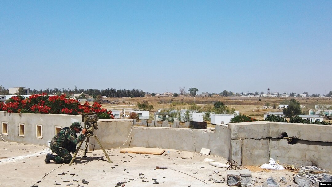 FILE - A member of the Libyan internationally recognized government forces is seen during a fight with Eastern forces, in southern Tripoli, Libya June 22, 2019.