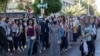 Syrian students show up to votes at a polling station during the presidential election in the capital, Damascus, May 26, 2021.