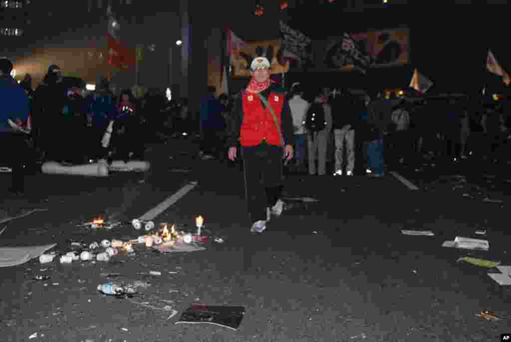 As night fell, police thwarted demonstrators from reaching a rallying point for a candelight vigil.
