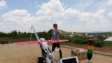 A Zipline engineer prepares a a drone for test flight at an operations base in Muhanda, south of Rwanda's capital, Kigali. Rwanda was California-based Zipline's first African operations area. Taken Oct. 12, 2016.