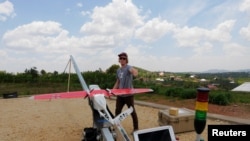 A Zipline engineer prepares a a drone for test flight at an operations base in Muhanda, south of Rwanda's capital, Kigali. Rwanda was California-based Zipline's first African operations area. Taken Oct. 12, 2016.