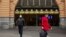 People are seen outside of Flinders Street Station amidst a lockdown in response to an outbreak of the coronavirus disease (COVID-19) in Melbourne, July 17, 2020.