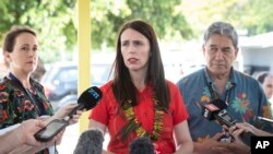 FILE - In this Sept. 5, 2018, file photo, New Zealand's Prime Minister Jacinda Ardern, center, and Foreign Affairs Minister Winston Peters, right, speak to the media during the Pacific Islands Forum in Nauru. New Zealand plans to increase the number…