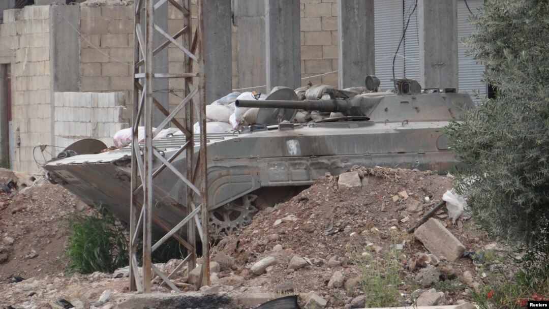 A Syrian government military vehicle is seen in Talbiseh near Homs, Syria, May 22, 2012.