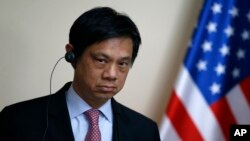 FILE - Hoyt Brian Yee, Deputy Assistant Secretary for European and Eurasian Affairs, listens as Serbian Prime Minister Aleksandar Vucic speaks during a shared news conference, in Belgrade, May 24, 2017.