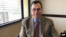 In this May 8, 2019, file photo, Lee Francis Cissna, director of U.S. Citizenship and Immigration Services, sits for a photo in Laguna Niguel, California.