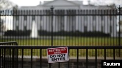 FILE - A restricted area sign is seen outside of the White House in Washington on Nov. 27, 2015.