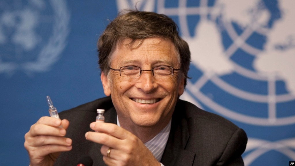 FILE - In this Tuesday, May 17, 2011 file photo, Microsoft founder Bill Gates holds a vaccine for meningitis during a news conference at the United Nations headquarters in Geneva, Switzerland.