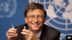 FILE - In this Tuesday, May 17, 2011 file photo, Microsoft founder Bill Gates holds a vaccine for meningitis during a news conference at the United Nations headquarters in Geneva, Switzerland.