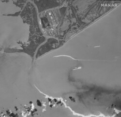 This satellite image provided by Maxar Technologies shows an overview of Port Fourchon, La., and oil slicks on Sept. 2, 2021.