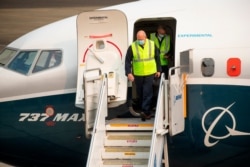 FILE - FAA chief Steve Dickson walks out of a Boeing 737 Max after concluding a test flight and landing at Boeing Field in Seattle, Sept. 30, 2020.