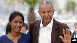 FILE - ‘Timbuktu’ director Abderrahmane Sissako, right, and actress Toulou Kiki appear at France's film festival in Cannes, May 15, 2014. 