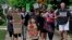 FILE - Jackson Borrello, 8, leads activists with a Tuesdays with Tillis rally outside U.S. Senator Tom Tillis' office at the Federal Building to demand the reunification of families separated at the border in Raleigh, N.C., June 26, 2018.