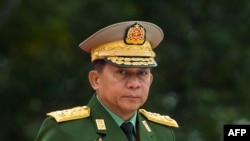 FILE - Myanmar's Chief Senior General Min Aung Hlaing, commander-in-chief of the Myanmar armed forces, arrives for a ceremony to mark the 71th anniversary of Martyrs' Day in Yangon on July 19, 2018.