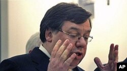 Irish Prime Minister Brian Cowen reacts during a press conference at government buildings in Dublin, Ireland, regarding a massive EU-IMF bailout, 22 Nov 2010