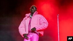 FILE: Young Thug performs on Sunday, Aug. 1, 2021, at Grant Park in Chicago. The Atlanta rapper, whose name is Jeffery Lamar Williams, was arrested Monday, May 9, 2022, in Georgia on conspiracy to violate the state's RICO act and street gang charges, according to jail records.