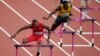 Michael Tinsley of the U.S. (L) and Jamaica's Leford Green clear hurdles during the men's 400m hurdles in London in 2012. 