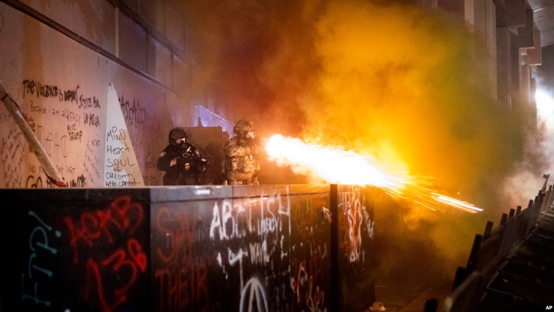 Federal agents use crowd control munitions to disperse Black Lives Matter protesters at the Mark O. Hatfield United States Courthouse, July 19, 2020, in Portland, Oregon.