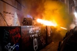 Federal agents use crowd control munitions to disperse Black Lives Matter protesters at the Mark O. Hatfield United States Courthouse, July 19, 2020, in Portland, Oregon.