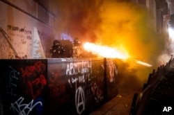 Federal agents use crowd control munitions to disperse Black Lives Matter protesters at the Mark O. Hatfield United States Courthouse, July 19, 2020, in Portland, Oregon.