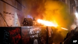 Federal agents use crowd control munitions to disperse Black Lives Matter protesters at the Mark O. Hatfield United States Courthouse, July 19, 2020, in Portland, Oregon.