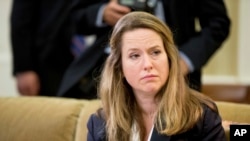 FILE: Then-Deputy Homeland Security Adviser Amy Pope listens as President Barack Obama speaks in the Oval Office at the White House in Washington, Taken May 20, 2016.